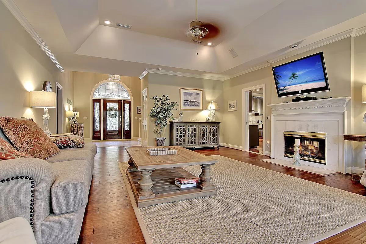 Living room with fireplace and lagoon view